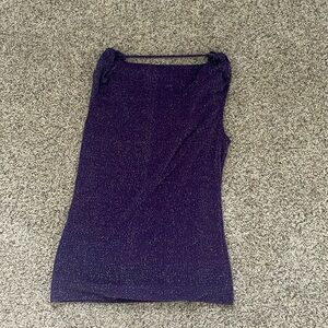this is a purple sparkly shirt that can be worn to nice restaurants or stores.(S